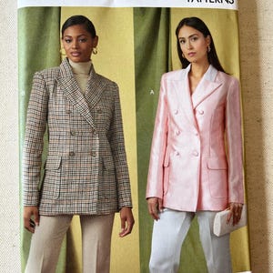 May include: Vogue Patterns sewing pattern featuring two double-breasted blazers. One blazer is a brown and tan plaid, the other is a light pink. The pattern includes sizes 8-16. The Vogue Patterns logo is at the top.