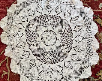 Vintage  32”  hand crocheted table cloth. Pink  color with small flaw