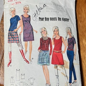 May include: A white paper sewing pattern envelope titled Poor Boy meets the Hipster, featuring illustrations of five outfits including dresses, skirts, tops, and pants. The envelope displays size 11, bust 31.5 inches, and technical line drawings.