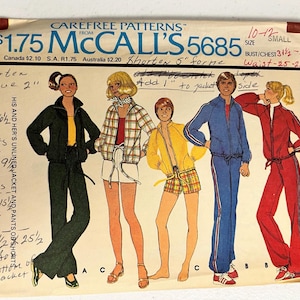 May include: A vintage Carefree Patterns from McCall's 5685 sewing pattern envelope for jackets, pants, and shorts. The front features illustrations of four figures wearing various athletic outfits, with handwritten notes regarding alterations and measurements.