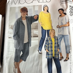 May include: A McCall's 2685 sewing pattern envelope featuring illustrations of various outfits including a solid blue jacket with matching cropped pants, a yellow long-sleeve top with blue jeans, and a plaid jacket with solid blue pants.