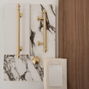 May include: A rustic wooden sign with the text "Welcome to our home" in white lettering. The sign has a distressed finish and a simple, inviting design, ideal for entryway decor.