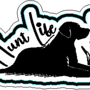 May include: A black and white sticker featuring a silhouette of a dog lying down, with the words "Hunt Life" in a stylized font. A bird flies above the dog, and tall grass is to the right. The sticker has a white border with a teal outline.
