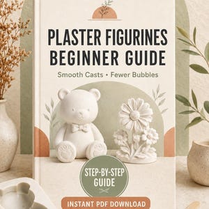 May include: A book titled Plaster Figurines Beginner Guide with the subtitle Smooth Casts Fewer Bubbles. The cover features a white bear figurine and a white flower figurine, a green circular badge stating Step-by-Step Guide, and Instant PDF Download.