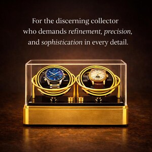 May include: A gold watch winder with two compartments, each holding a wristwatch. The watches have blue and cream-coloured faces. The winder is encased in a clear acrylic box, with text that reads, "For the discerning collector who demands refinement, precision, and sophistication in every detail."