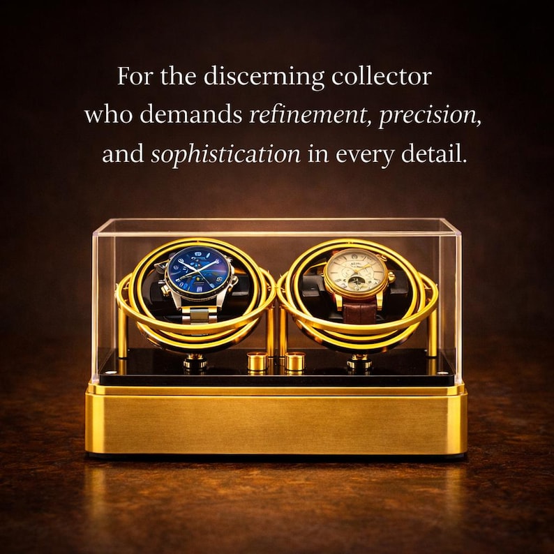May include: A gold watch winder with two compartments, each holding a wristwatch. The watches have blue and cream-coloured faces. The winder is encased in a clear acrylic box, with text that reads, "For the discerning collector who demands refinement, precision, and sophistication in every detail."