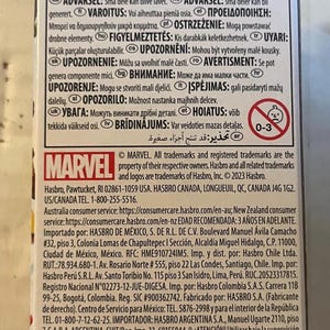 May include: A product package with the Marvel logo, warnings in multiple languages, and a recycling symbol. The package includes text in English, French, and Spanish. The age range is 0-3.