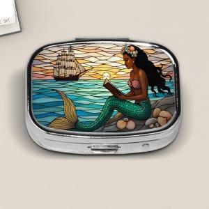 Black Mermaid Pill Box – Stained Glass Style Sunset Ocean Scene – Fantasy Travel Pill Case with Book and Sailing Ship Design