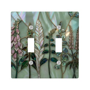 May include: A set of three ceramic mugs with a speckled, matte finish. The mugs are in shades of cream, light gray, and dark gray. Each mug has a simple, minimalist design, perfect for coffee or tea.
