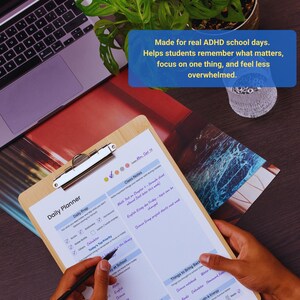 May include: A wooden clipboard with a daily planner sheet, featuring checkboxes and sections for notes and priorities. The text on the sheet includes "Daily Prep" and "Class Notes." A laptop and a plant are in the background. Text on the image says "Made for real ADHD school days."