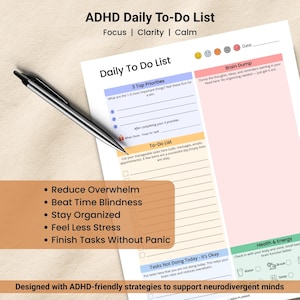 May include: A white ADHD Daily To-Do List planner with a black pen. The planner includes sections for priorities, a to-do list, and a brain dump. Text includes "Reduce Overwhelm" and "Finish Tasks Without Panic."