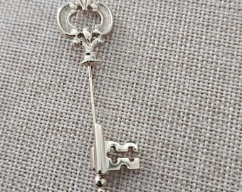 Vintage Avon Skeleton Key Stick goudkleurige reversspeld