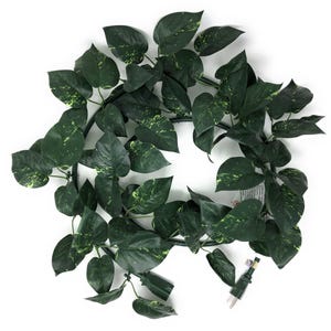 May include: A green artificial ivy garland with variegated leaves, perfect for adding greenery to your home decor. The garland is strung on a wire and has a plug at the end.