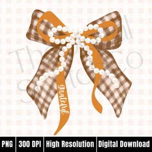 May include: A digital illustration of a decorative bow with a brown and white checkered pattern. The bow has orange ribbon accents and is adorned with a string of white pearls. The word "grateful" is written on one of the orange ribbons.
