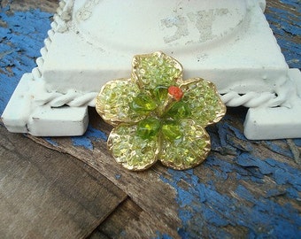 Green glass flower brooch