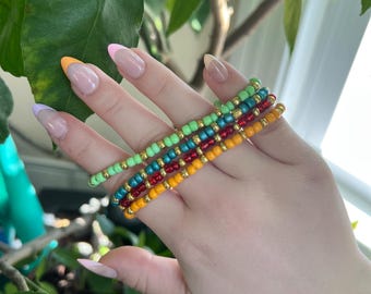 pulseira de miçangas de bóia dourada