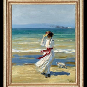 May include: A painting depicting a woman in a white dress and a straw hat walking along a beach with a small dog. The woman is holding her hat with one hand and her dress is blowing in the wind. The sea is in the background and a ship can be seen in the distance.