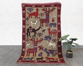 Handmade Wool Tribal Rug: Vintage Animal Motif, Red & Blue Accents (5.0 x 3.1 ft.)