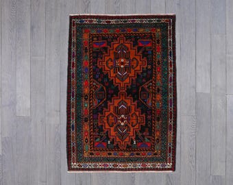 Handwoven Tribal Rug with Intricate Geometric and Symbolic Patterns