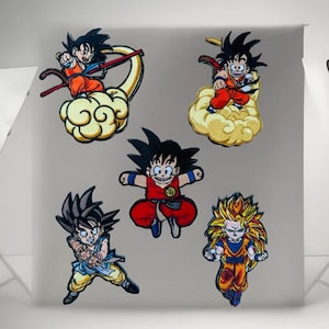 May include: Five embroidered iron-on patches featuring characters from the anime Dragon Ball Z. The patches are yellow, orange, red, and blue. The characters are Goku, Vegeta, Gohan, and Piccolo.
