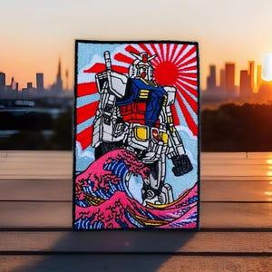 May include: A colorful embroidered patch featuring a robot standing on a wave with a rising sun in the background. The robot is white, blue, red, and yellow. The wave is pink, blue, and yellow. The sun is red and white.