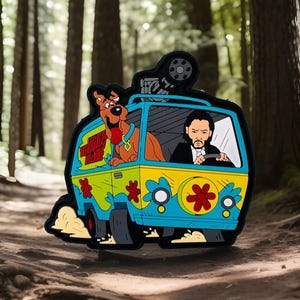 May include: A blue and yellow cartoon van with a flower design, driven by a man with a beard and a black suit. A brown cartoon dog with a red tongue is sticking its head out of the passenger side window. The van has the words "The Mystery Machine" written on the side.
