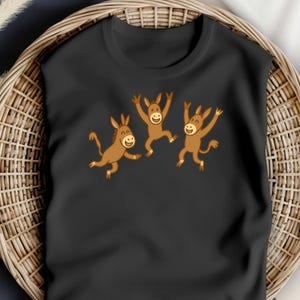 donkey t-shirt, donkey shirt, animal lovers tee Three happy donkeys leap with joy in  playful, cartoon-style design. mule lovers