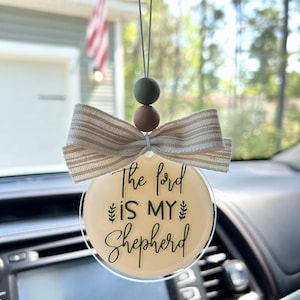 May include: A handmade wooden sign with the text "Welcome to our home" in a handwritten style. The sign is painted white with black lettering and a distressed finish, perfect for home decor.