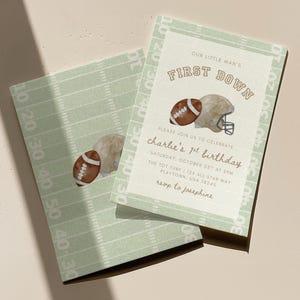 May include: Two light green football-themed invitations. One features a football and helmet graphic with the text "FIRST DOWN" and "charlie's 1st birthday". The other has a football graphic and field lines.