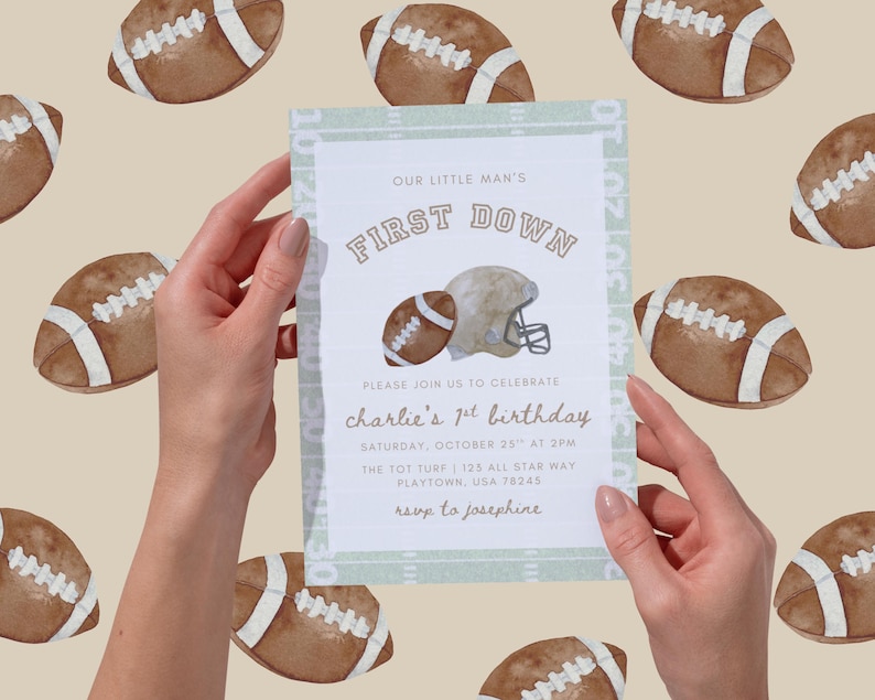 May include: An invitation with the text "OUR LITTLE MAN'S FIRST DOWN" and "charlie's 1st birthday". The invitation features a football and helmet illustration. The background has a pattern of footballs. The invitation is light green and white.
