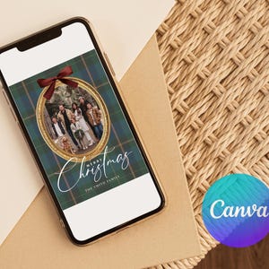 May include: A smartphone displays a Christmas card design. The card features a family photo within a gold oval frame, set against a green and blue plaid background. A red bow adorns the top, with the words "Merry Christmas" and "The Smith Family" in elegant script.