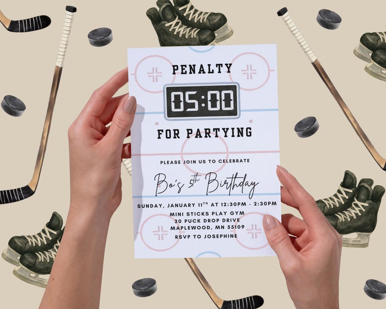 May include: A hockey-themed birthday invitation held by hands. The invitation reads "PENALTY FOR PARTYING" with a digital clock graphic showing "05:00". The invitation also includes party details, hockey sticks, skates, and pucks.