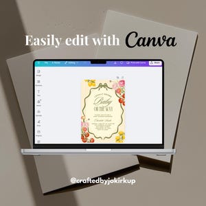 May include: A laptop displays a baby shower invitation design with the text "Baby on the Way." The invitation features floral and fruit illustrations. The words "Easily edit with Canva" are above the laptop screen.
