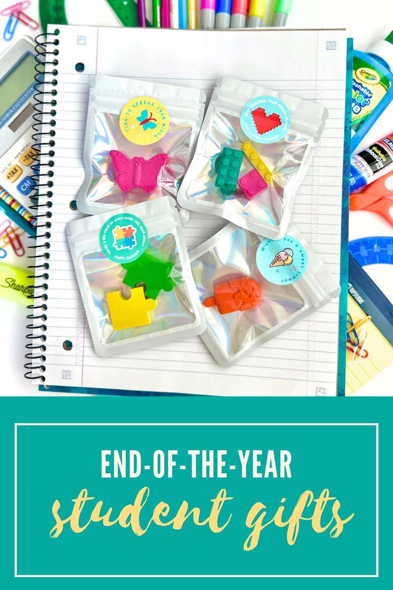 May include: Four small, clear, iridescent pouches containing colorful shaped erasers. One pouch holds a pink butterfly, one has green and yellow building blocks, one contains green and yellow puzzle pieces, and one holds an orange popsicle eraser.