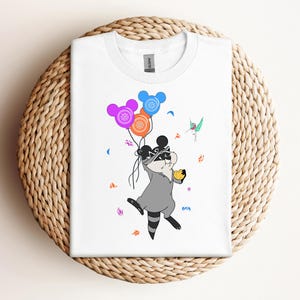 Cute Meeko Raccoon And Flit With Mickey Balloons T-shirt, Disney Pocahontas Characters Shirt, WDW Disneyland Girl Trip, Family Vacation 2025