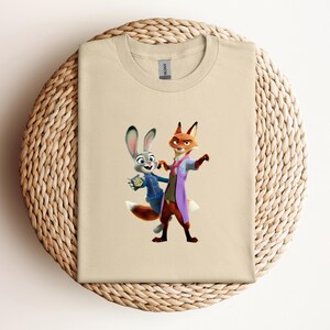 May include: A white ceramic mug with a black handle and the text "But first, coffee" in a handwritten style. The mug is on a white surface. The mug is 4 inches tall.