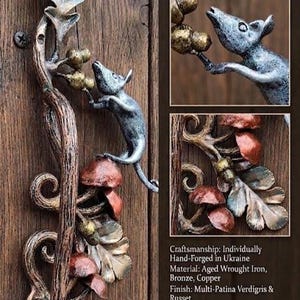 May include: Hand-forged door handle featuring a whimsical design with a mouse, leaves, and mushrooms. The handle is made of aged wrought iron, bronze, and copper, with a multi-patina finish. Dimensions are approximately 19.7 inches (50cm).