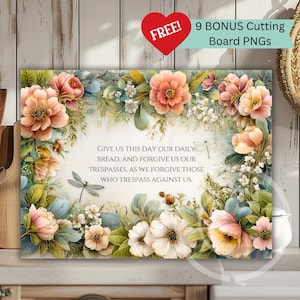 May include: A rectangular floral art print with a prayer, framed by peach and pink flowers, green leaves, and dragonflies. The text reads "GIVE US THIS DAY OUR DAILY BREAD, AND FORGIVE US OUR TRESPASSES, AS WE FORGIVE THOSE WHO TRESPASS AGAINST US."