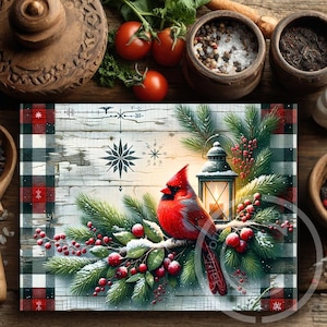 May include: A decorative Christmas-themed placemat featuring a vibrant red cardinal perched on a snow-covered branch with berries and a lantern. The design includes a buffalo plaid border in red, black, and white, with snowflake accents. The background has a rustic, weathered wood appearance.