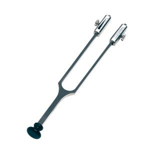 May include: A white ceramic mug with a black handle and the text "But First, Coffee" in a bold, black font. The mug is set against a blurred background, suggesting a cozy setting. The mug appears to be approximately 4 inches tall.