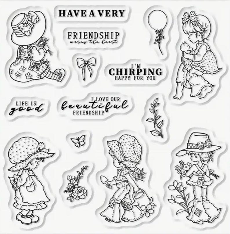 May include: A set of clear rubber stamps featuring illustrations of girls wearing hats and dresses, along with various phrases like "Have a Very Friendship", "I'm Chirping Happy for You", and "Life is Good".