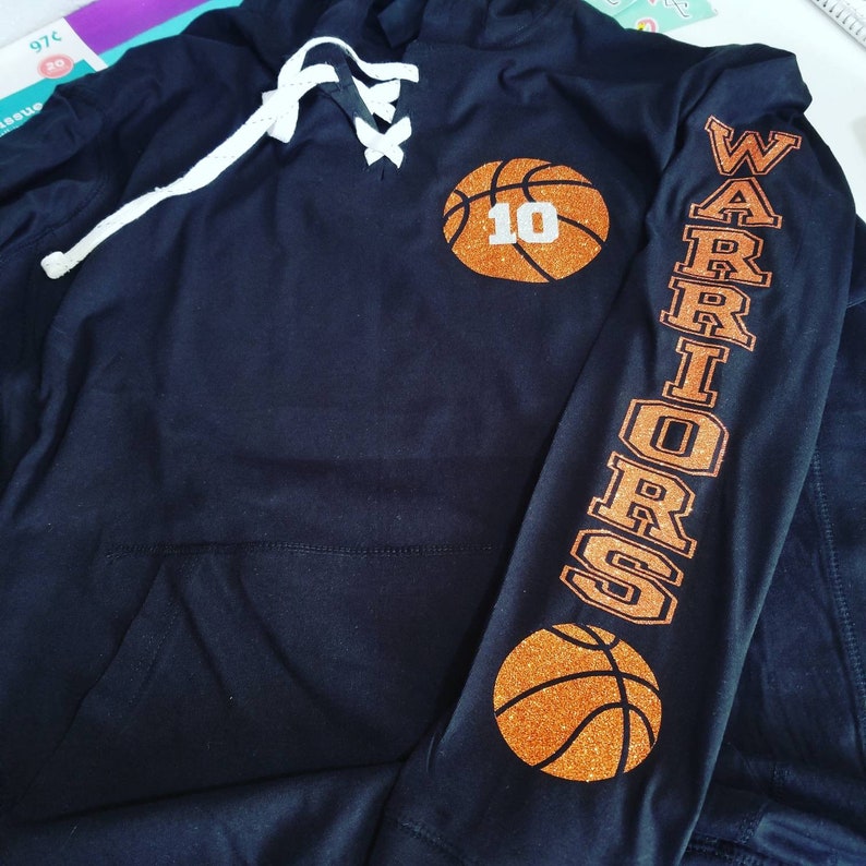 basketball jersey over a hoodie