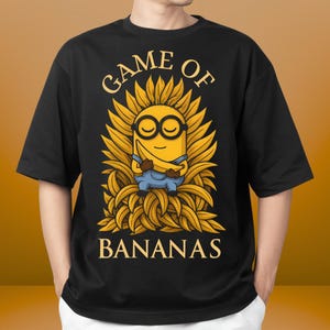 Minion with Banana T-Shirt, Funny Cartoon Minions Shirt, Casual Unisex Softstyle Tee for Minions Fans, Humorous Gift for Banana Lovers