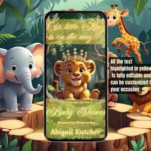 May include: A baby shower invitation featuring a lion cub wearing a crown, surrounded by cartoon animals. The invitation on a phone screen reads "Our little King is on the way!" and includes the name Abigail Kutcher.