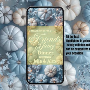 May include: A smartphone screen displays a Friendsgiving dinner invitation. The invitation features text in a decorative font, surrounded by pumpkins and floral accents in shades of white, cream, and blue. The text says "Friendsgiving Dinner hosted by Mia & Alex."