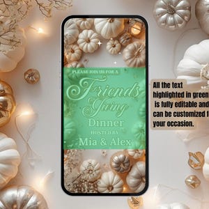 May include: A smartphone screen displays a Friendsgiving Dinner invitation with a green and white design. The invitation is surrounded by white, gold, and silver pumpkins, and decorative elements. Text on the screen reads "Friendsgiving Dinner" hosted by Mia & Alex.