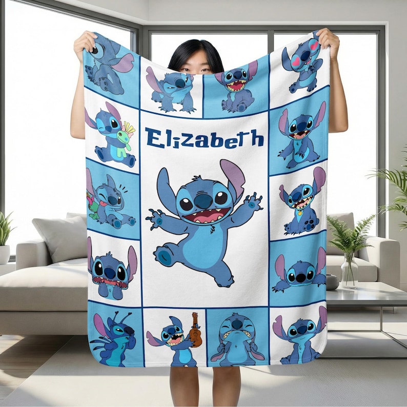 May include: A light blue and white blanket featuring multiple images of the character Stitch from the movie Lilo & Stitch. The name "Elizabeth" is printed in the center of the blanket.