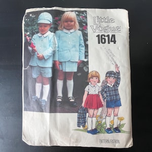 May include: Vintage sewing pattern titled "Little Vogue 1614." The pattern cover features illustrations of children in various outfits, including light blue suits and plaid ensembles. The cover is slightly aged with visible wear.