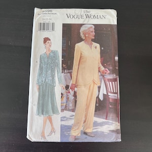 May include: A sewing pattern envelope for The Vogue Woman, model 2596, size 20-22-24. The front displays illustrations of two outfits: a sage green jacket and skirt set, and a yellow jacket and trousers set, both featuring long sleeves and collars.