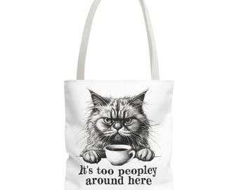 May include: A white tote bag with a black and white illustration of a grumpy cat holding a cup of coffee. The text "It's too peopley around here" is printed below the cat.